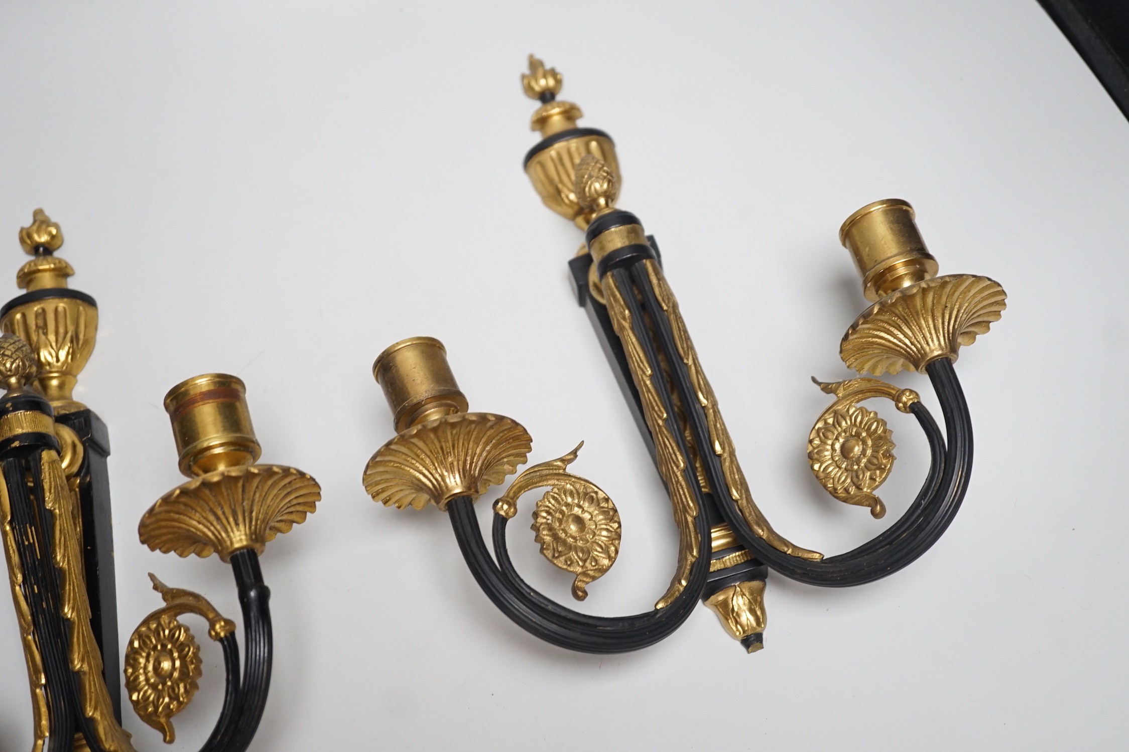 A pair of ormolu 2 branch wall lights, 32cms high